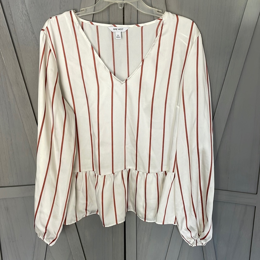 White blouse with orange vertical stripes